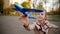 Nice girl launching a toy blue plane on the playground
