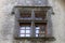 Nice glimpse of a window in an ancient castle in an alpine village