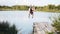 Nice guy jumping off the dock into the lake. Delayed frames. It\'s very beautiful.