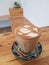 Nice heart shape of hot latte art coffee