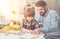 Nice intelligent boy doing a jigsaw puzzle with his father