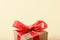 Nice little gift box with red bow. Vintage retro present with copy space.