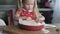 A nice little girl makes a cake