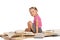 Nice little girl sitting on pile of books