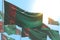 Nice many Turkmenistan flags are waving against blue sky picture with bokeh - any holiday flag 3d illustration