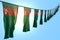Nice memorial day flag 3d illustration - many Turkmenistan flags or banners hangs diagonal on string on blue sky background with