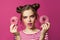 Nice model woman holding donuts on colorful pink background