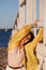 Nice plus size woman on wooden structure on beach