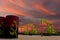 Nice pumpjack oil extraction and cloudy sky in sunset with the ANGOLA flag on oil barrels 3D rendering