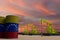Nice pumpjack oil extraction and cloudy sky in sunset with the Venezuela flag on oil barrels 3D rendering