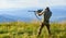 Nice shot. Army forces. Hunter hold rifle. Hunter mountains landscape background. Focus and concentration experienced
