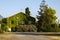 Nice single family home. Simple house with greenery. View of the house against the blue sky, mountains