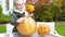 Nice smiling girl carving pumpkin Jack, having fun, enjoying Halloween eve