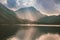 Nice sun rays over Vorderer langbathsee lake in Austria Alp mountain. Fall colors