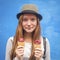 Nice teen girl with ice cream, blue wall background (Instagram style series)