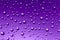 Nice ultraviolet gradient color background from water drops of the different size. Abstract background