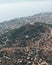 Nice vertical eagle-eye shot of a hill, town and a sea