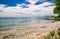 Nice view of outdoor park beach near the lake ontario with many birds sitting in water