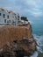 Nice view of a street of white houses in the town of Peniscola, Spain, on the cliff by the sea