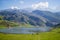 Nice views of Ercina Lake in Covadonga, Asturias, Spain. Green grassland with a glaciar lake and mountains at the background