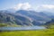 Nice views of Ercina Lake in Covadonga, Asturias, Spain. Green grassland with a glaciar lake and mountains at the background