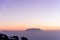 Nice white fog at the mountain in the morning with sunrises light and tree silhouette and small mountain in background