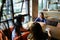 Nice women sitting at restaurant, talking and drinking coffee.