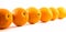 Nicely colored oranges on a white background - front and back lined next to each other