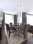 Nicely decorated luxury living, dining room. Dining table and some chairs. Interior design