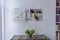 Nicely decorated small bookshelf with a shabby wooden white shutter in a room of a country house