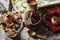 Nicely set table for dinner. Hot soup in a clay pot is waiting for guests. Photos in vintage style. Close-up