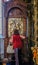 Nicosia, Cyprus - May 14, 2018: Icon for George in the Holy Mary Church in the old town of Nicosia. Shows the rear view of a lady