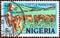 NIGERIA - CIRCA 1973: A stamp printed in Nigeria shows Cattle ranching, circa 1973.