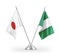 Nigeria and Japan table flags isolated on white 3D rendering