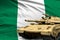 Nigeria modern tank with not real design on the flag background - tank army forces concept, military 3D Illustration