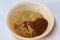 Nigeria, Yoruba cuisine; Close up a small bowl of spices, turmeric, cardamom, cardamum, cloves, ginger, black pepper, paprika