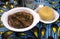 A Nigerian dish of Vegetable soup and Yellow Garri or Eba