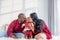 Nigerian father, Asian mother holding and kissing a 4-month-old baby newborn son