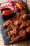Nigerian spicy suya kebab on skewers with fresh vegetable salad
