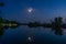 Nighshot with moon reflecting on water of the river Havel