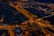 Night aerial photo of port vellof with yachts, Barceloneta, center of Barcelona and road with car traffic. Aerial view