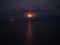 Night aerial photography. red moon through the clouds and moonlight on the water