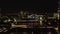 Night aerial view of bridges across Thames river. Trains and vehicles driving over bridges. Illuminated Tower Bridge in