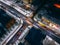 Night aerial view of crossroad with circular cars in small european city