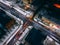 Night aerial view of crossroad with circular cars in small european city