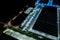 Night Aerial view of goods warehouse. Logistics center in industrial city zone from above. Aerial view of trucks loading at