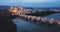 Night aerial view of the historic center of Cordoba with the ancient Roman bridge over the Guadalquivir river and the