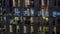 Night aerial view of office building glass window facade with illuminated lighted workspace rooms timelapse.