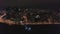 Night aerial view on panorama of amazing megapolis with lights in windows of high buildings