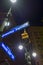 Night backlit street sign corner sixth ave broadway blue white s